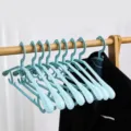 Blue plastic clothes hangers with wide shoulder design for home wardrobe and clothing drying use. - Wide Shoulder Non-Slip Style / Cloud Blue
