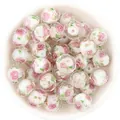 Detail shot of faceted glass millefiori beads with pink rose and gold sand, perfect for DIY jewelry. - 10 Pieces/Pack (12mm) / White