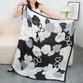 Silk feel large square scarf featuring classic black and white camellia floral pattern, elegant accessory. - Elegant Vintage Roses