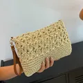 Handmade hollow-out straw woven clutch bag with brown wristlet strap - Off White