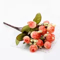 Close-up detail of artificial mini rose bouquet, coral pink faux flower buds for photography props. - Qiuxing Sunset