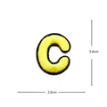 Yellow embroidered letter C patch detail, black border clothing accessory 2.8x3.4cm. - Letter C