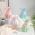 Creative paper bag style plastic vase with pink bow detail, Nordic home decor tabletop piece. - Lotus Leaf Edge Vase / White