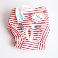 Detailed view of red and white striped pet physiological pants with cartoon face design - S / Red Rabbit Striped
