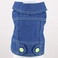Close-up detail of a dark blue pet denim vest featuring vibrant lime green buttons and stitching. - XS / Green Buttons