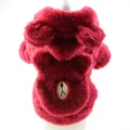 Close-up detail of a soft red plush dog hoodie featuring a cute bear face embroidery - Red