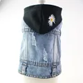 Detail view of denim pet vest with black hood featuring daisy embroidery - XS / Daisy Embroidery Style / Washed Blue with Black Hood