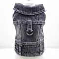Detail view of a black denim pet vest with a metal D-ring for leash attachment - XS / Black