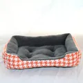 Detailed view of the warm pet bed featuring orange houndstooth fabric and grey plush lining - Orange Houndstooth