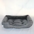 Detailed close-up view of a soft grey plush dog bed featuring a stylish houndstooth pattern - Black Houndstooth