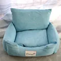 Close-up of a cozy light blue pet sofa bed with a removable cushion and brand label. - XS / 35*45cm / Magnolia