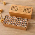 A complete 40-piece wooden alphabet and number stamp set in a vintage kraft box - 40 Pieces / Black Base Stamps