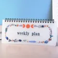 Planner settimanale con ghirlanda di fiori e fasi lunari, rilegatura a spirale - Agenda Settimanale Ghirlanda
