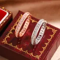 Detailed view of two elegant eternity rings with square-cut cubic zirconia stones. - Size 6 / Silver (Platinum Plated)