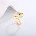 Macro view of gold sports ring featuring volleyball and heart design on white background - Volleyball Style (KYRA0360-2)