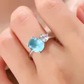 Elegant silver ring featuring oval light blue gemstone and heart-shaped white zircon - Size 6 / Deep Sea Blue Style (KYRA0538)