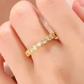 Close-up detail of vintage gold-plated ring with round and square cubic zirconia - Size 6 / Gold