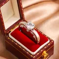 Detailed macro view of an elegant silver-colored ring with a large clear zircon in a red box. - Size 6 / Western Simple Heart Style (KYRA0680)