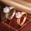 Detail view of classic six-prong moissanite rings in silver and rose gold finishes. - Size 6 / Silver