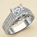 Close-up of square cut zircon ring with pave set stones on a silver-plated band - Size 6 / Silver (KYT017)