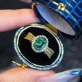 Elegant vintage gold oval green gemstone halo adjustable ring in blue jewelry box - Size 7 / Gold Plated Green Zirconia Style (KYRA02117) / Gold with Green Zirconia