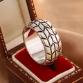 Close-up of a 6mm rhombus tire pattern ring displayed in a vintage red velvet jewelry box - Size 7 / Checkered Tire Pattern Style (KYRA0632W) / Antique Silver