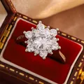Detailed macro shot of a sparkling snowflake rose gold ring with brilliant round zircons. - Size 6 / Silver