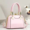 Elegant pink patent leather handbag with gold hardware and gemstone clasp, detailed view - 21*11*15 / Pink