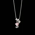 Detailed view of silver necklace with pink enamel flower charm and heart pendant - Pink Flower Necklace