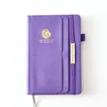 Purple faux leather 18-month planner featuring lion logo and elastic band closure - Purple