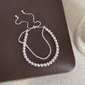 Elegant double-layer pearl and rhinestone bracelet displayed on a brown leather box - Double Layer Style (Style 1)