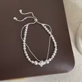 Detailed view of elegant multi-layered pearl bracelet with silver accents - Multi-layer Button Decor (Style 2)