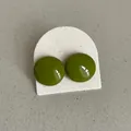Close-up of glossy olive green bean-shaped stud earrings on a textured white card - Geometric Round Bean Style (Style 17) / Dark Olive Green