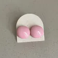 Detailed close-up view of pink round dome stud earrings on an off-white display card - Geometric Bean Style (Style 19) / Pink