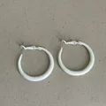 Detailed view of trendy thick white enamel hoop earrings with smooth glossy finish - Thickened Round Style / White