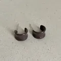 Close-up view of coffee brown enamel drip oil C-shaped geometric stud earrings for women - Rounded Geometric C-Shape Style (Style 34) / Chocolate