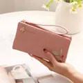 Elegant pink PU leather long wallet featuring leaf print and wrist strap for daily use - Pink