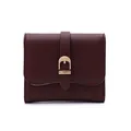 Burgundy women's short faux leather wallet featuring a stylish gold buckle closure detail - Burgundy