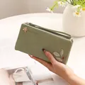 Long mint green PU leather wallet for women with leaf print decoration and wrist strap - Green