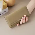 Minimalist olive green long wallet for women featuring elegant white stitching detail - Khaki