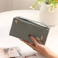 Elegant grey PU leather long wallet featuring leaf emblem printing and a secure wrist strap - Blue