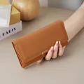 Minimalist women's long brown wallet featuring a high-quality smooth leather texture - Brown