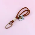Brown nylon braided rope keychain lanyard featuring a sturdy matte brown carabiner clip - Dark Coffee Beige