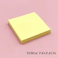 Close-up view of yellow 7.6x7.6cm square sticky notes stack on a pink background - 7.6x7.6cm / Yellow