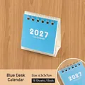 Compact blue 2027 mini desk calendar with spiral binding, size 6.3x3x7cm, 18 sheets - 2027 / Blue