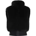 Gilet de ski chic en fausse fourrure noire pour femme, design sans manches et coupe-vent - S / Hauts / Noir