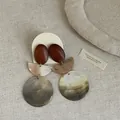 Detailed view of vintage round shell and wood patchwork earrings with natural textures - Style 8 Earrings