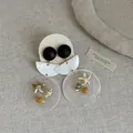 Close-up of retro shell and wood earrings with starfish and seashell charms - Style 11 Earrings