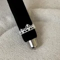Elegant silver lace hollow crown ring with sparkling crystals on black velvet display - Luxury Hollow Crown Style (Style 8 Ring)