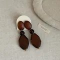 Close-up of vintage geometric dark brown wooden drop earrings on linen background - Style 8 Earrings
